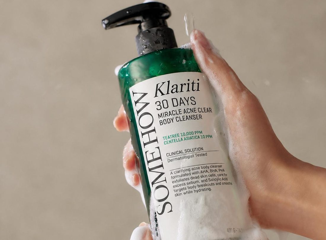 Lathering Klariti cleanser in the shower
